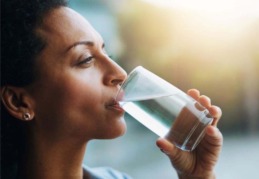 Happy customer drinking clean water